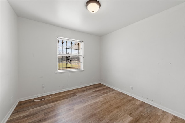 unfurnished room featuring wood-type flooring