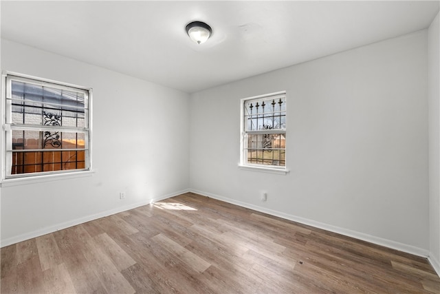 spare room featuring hardwood / wood-style flooring