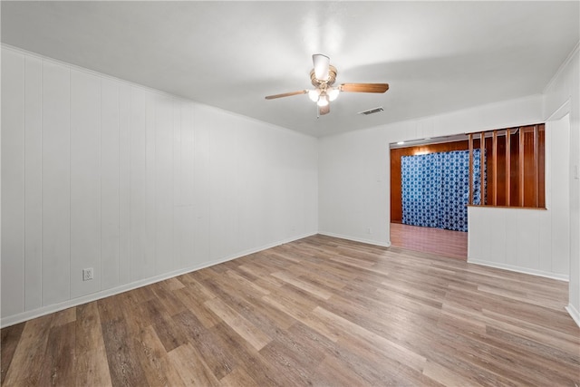 spare room featuring ceiling fan and light wood-type flooring