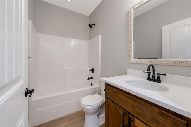 full bathroom with hardwood / wood-style flooring, vanity, toilet, and bathtub / shower combination