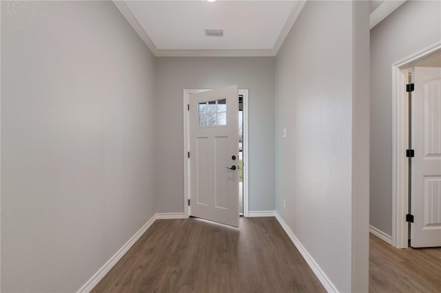 foyer featuring wood finished floors, visible vents, and baseboards