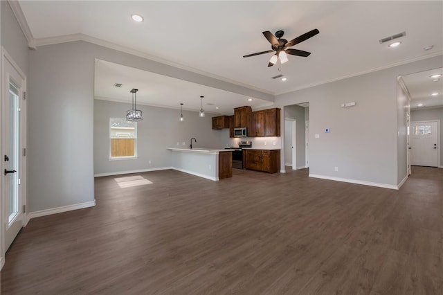 unfurnished living room with dark hardwood / wood-style flooring, crown molding, sink, and ceiling fan with notable chandelier