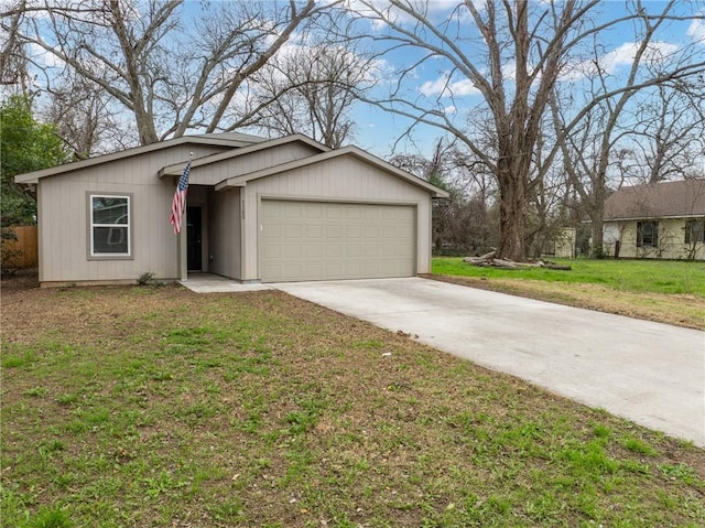 single story home with a garage and a front yard