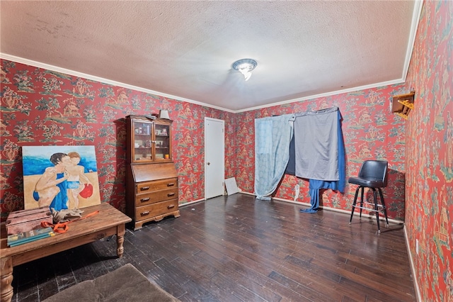 miscellaneous room featuring crown molding, dark hardwood / wood-style flooring, and a textured ceiling