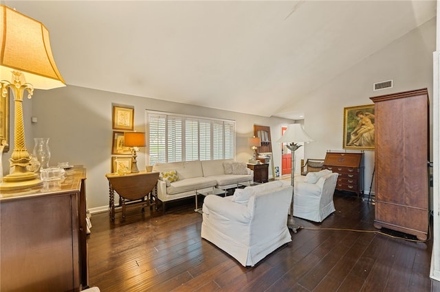 living room with dark hardwood / wood-style floors and high vaulted ceiling