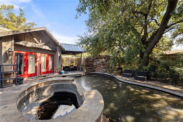 view of swimming pool featuring a patio