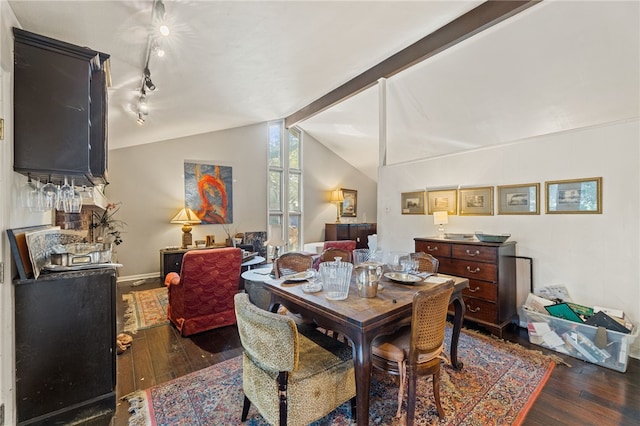 dining area with lofted ceiling with beams and dark wood-type flooring