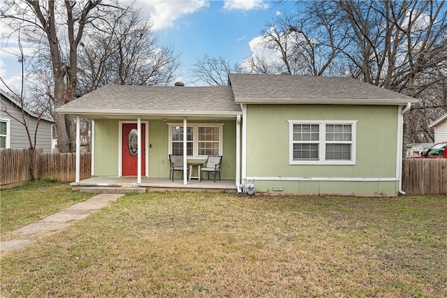 view of front of home with a porch and a front yard