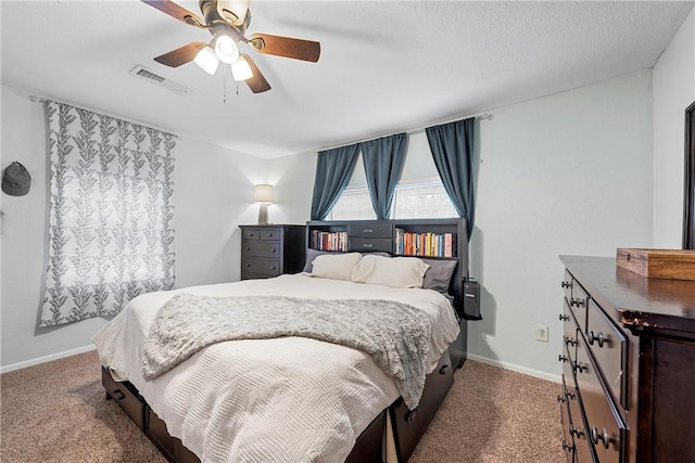 bedroom with ceiling fan and carpet