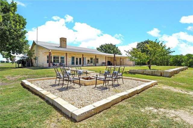 view of patio with a fire pit