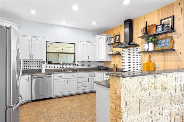 kitchen featuring white cabinetry, sink, range hood, and appliances with stainless steel finishes