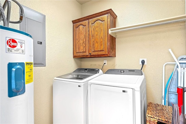 laundry room featuring cabinets, independent washer and dryer, and water heater