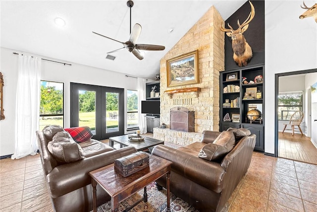 living room with ceiling fan, french doors, high vaulted ceiling, a fireplace, and light wood-type flooring