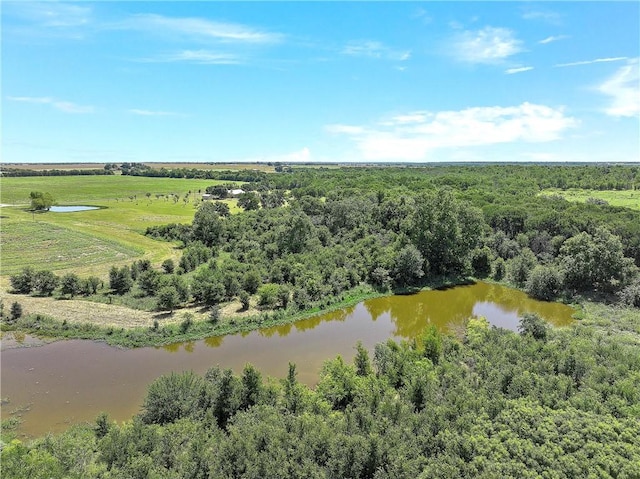 birds eye view of property with a water view and a rural view