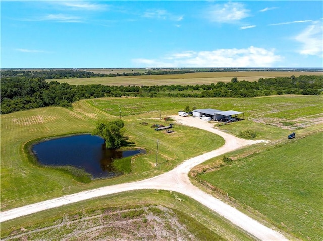 bird's eye view with a water view and a rural view