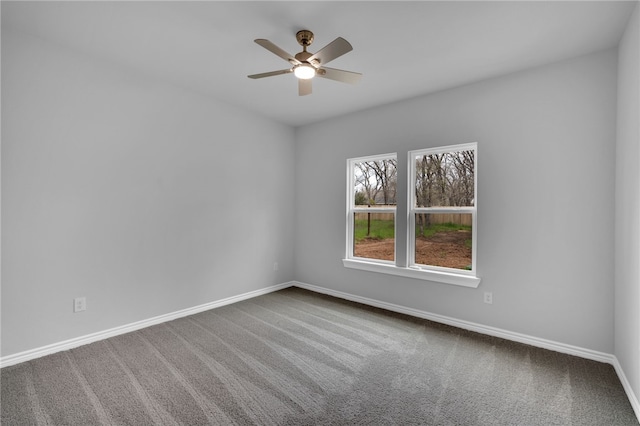 spare room with carpet flooring and ceiling fan