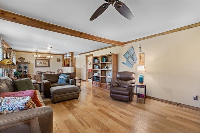 living room with ornamental molding, ceiling fan with notable chandelier, and light wood-type flooring