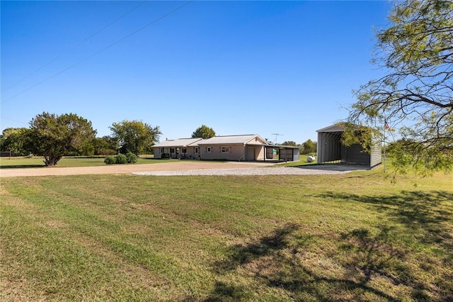 view of yard with a carport