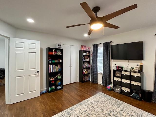 interior space with dark hardwood / wood-style floors and ceiling fan