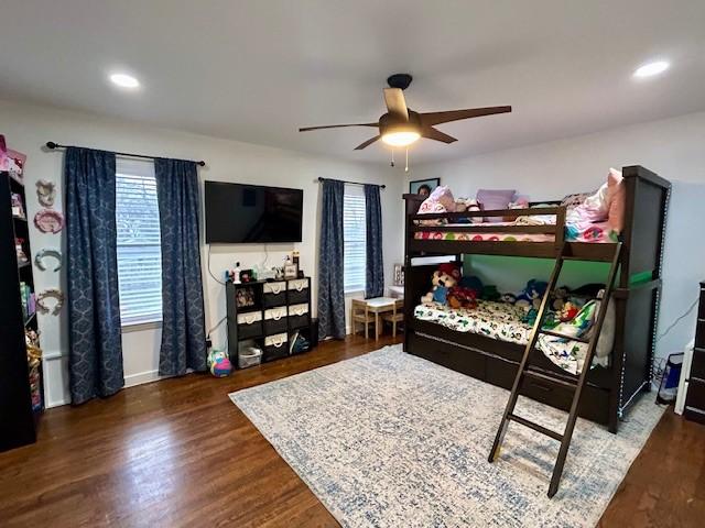 bedroom with dark wood-type flooring and ceiling fan