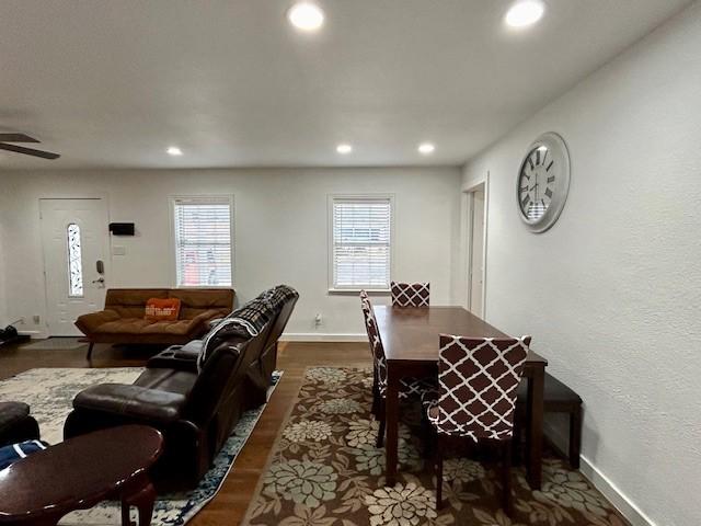 dining room featuring dark wood-type flooring and ceiling fan