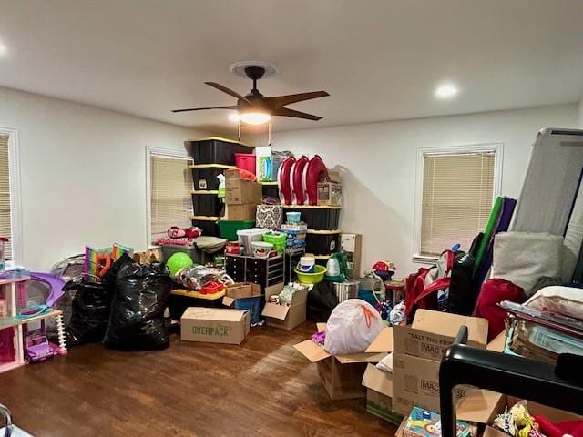 interior space with ceiling fan