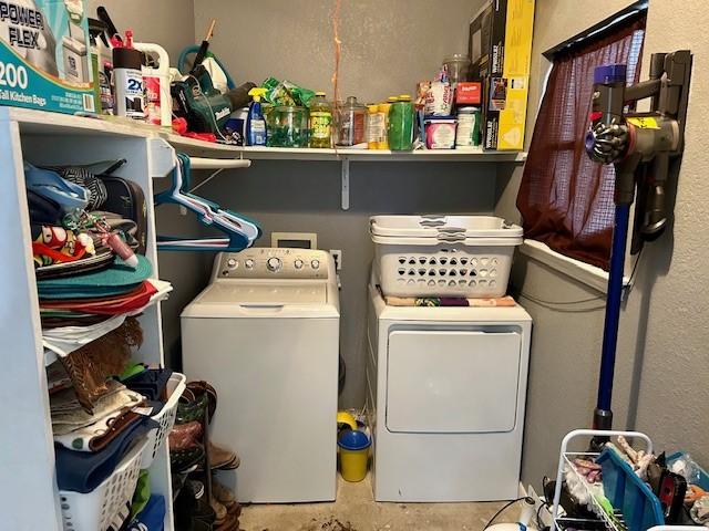 clothes washing area featuring washing machine and clothes dryer