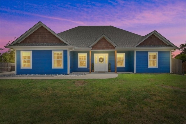 view of front of house featuring a lawn