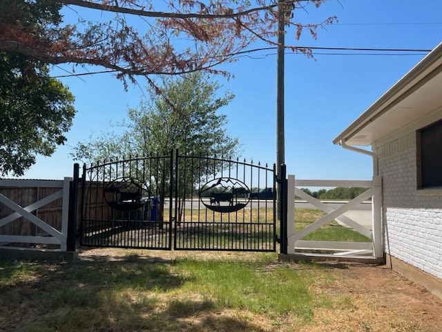 view of gate with fence