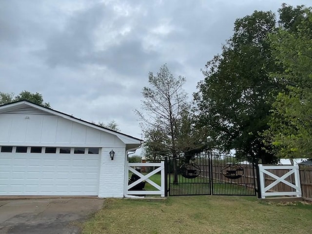 garage featuring a gate and fence