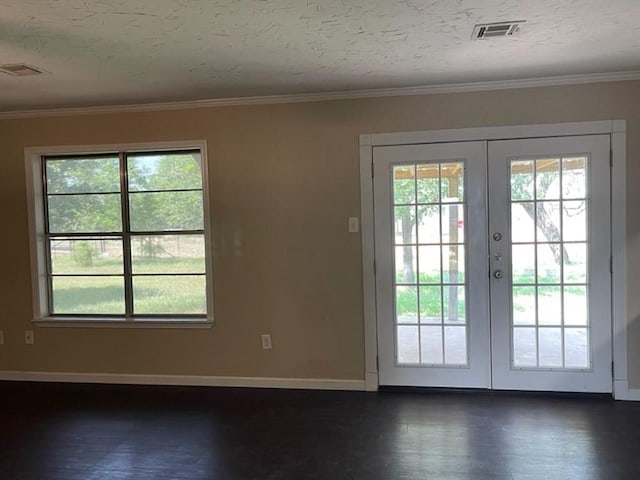 doorway to outside featuring visible vents, ornamental molding, a textured ceiling, and french doors