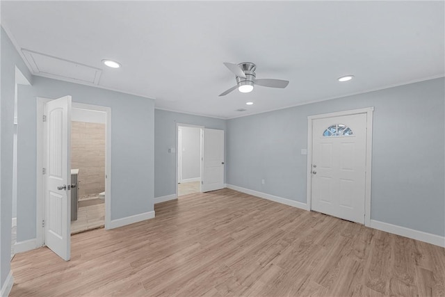 interior space featuring light wood-type flooring, a closet, ensuite bath, and ceiling fan