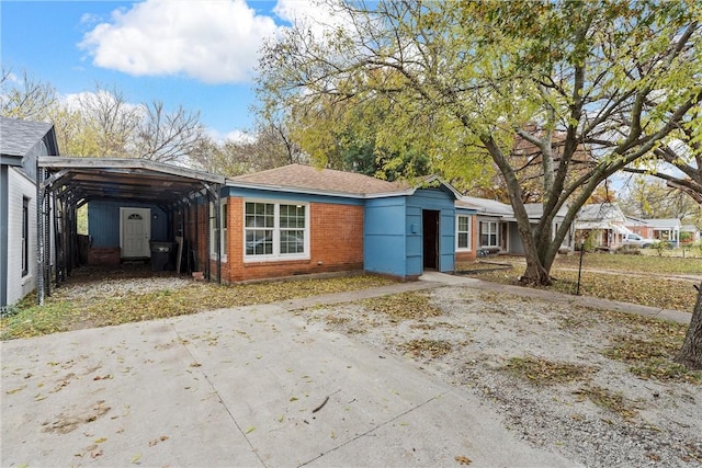 view of front of property featuring a carport