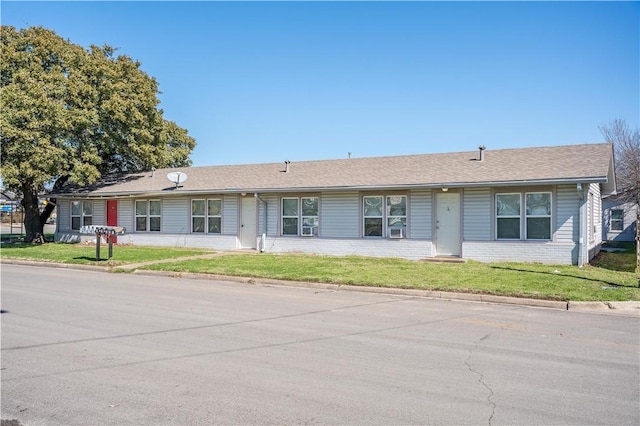 ranch-style home with a front yard