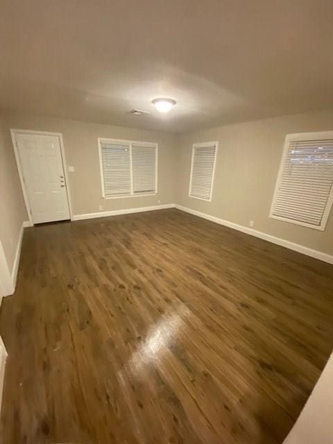 empty room featuring dark hardwood / wood-style floors