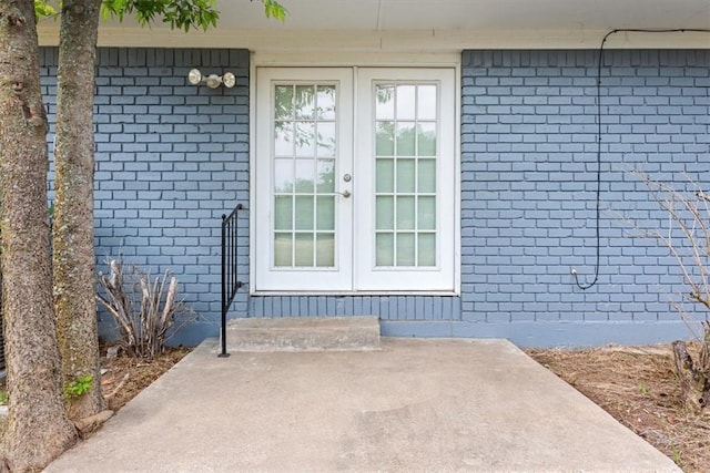 doorway to property featuring a patio area and french doors