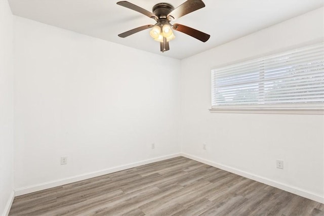 spare room featuring ceiling fan and hardwood / wood-style flooring