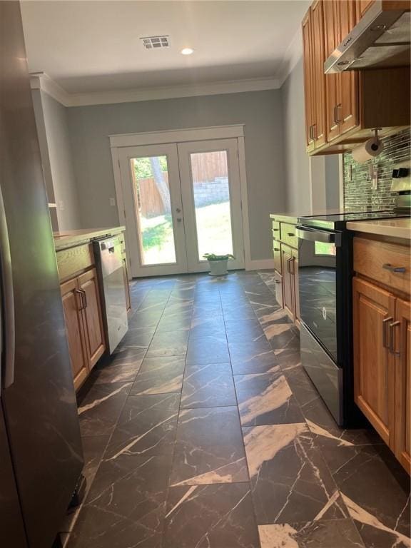 kitchen featuring french doors, crown molding, decorative backsplash, appliances with stainless steel finishes, and extractor fan