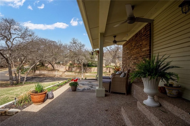 view of patio featuring ceiling fan