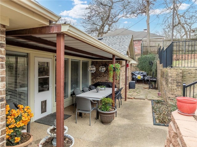 view of patio / terrace featuring fence