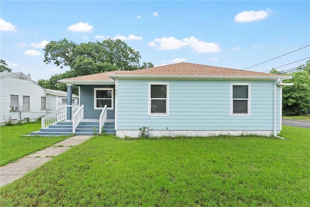 view of front facade with covered porch and a front lawn