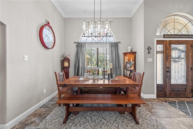 dining area featuring a notable chandelier and ornamental molding