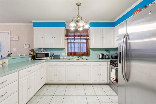 kitchen featuring decorative light fixtures, sink, white cabinets, a notable chandelier, and stainless steel appliances