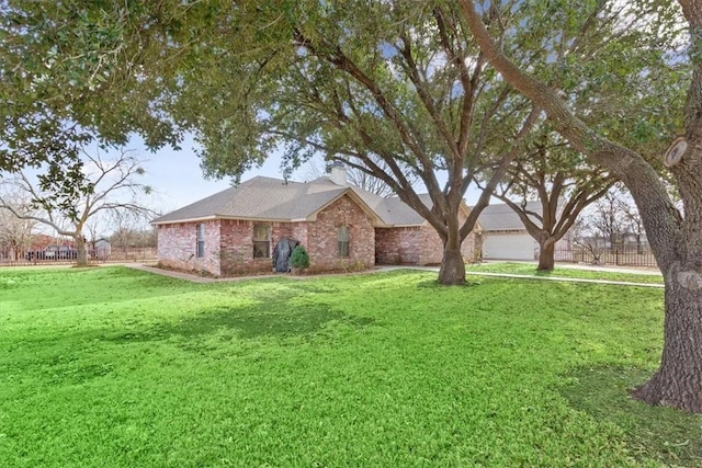 single story home featuring a front yard