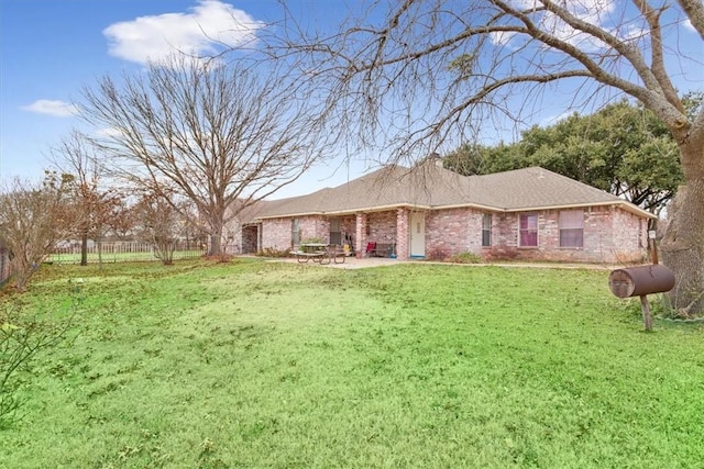 ranch-style house featuring a patio area and a front lawn