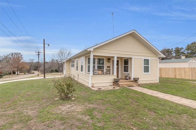 view of front facade with a porch and a front lawn