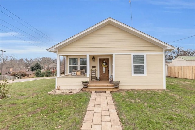 bungalow-style home with a porch and a front yard