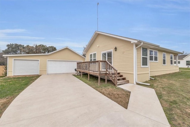 view of front facade featuring a garage and a front lawn