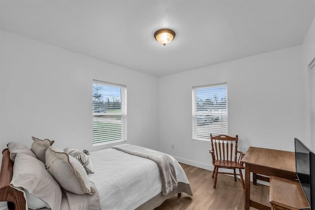 bedroom with light hardwood / wood-style floors