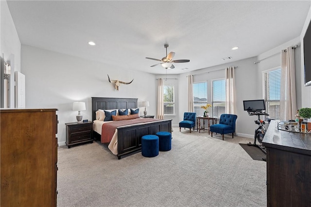 bedroom featuring ceiling fan and light colored carpet